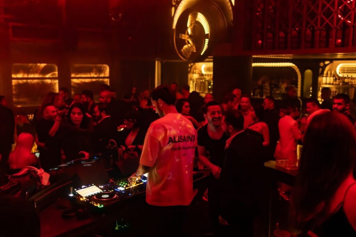 The Voyage floor at night, the crowd around the booth